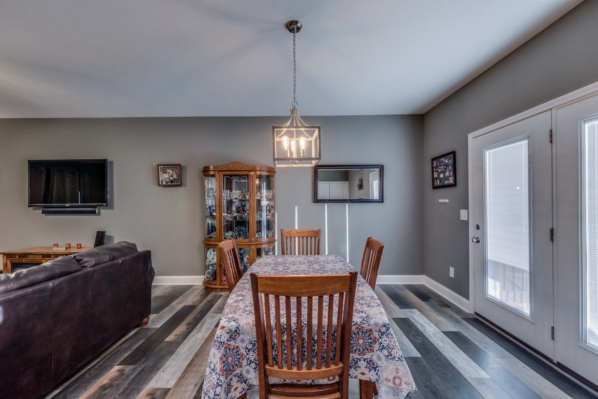 148 A T G T Road Portland, TN 37148 - Photo 13 of 30 a view of a dining room with furniture window and wooden floor