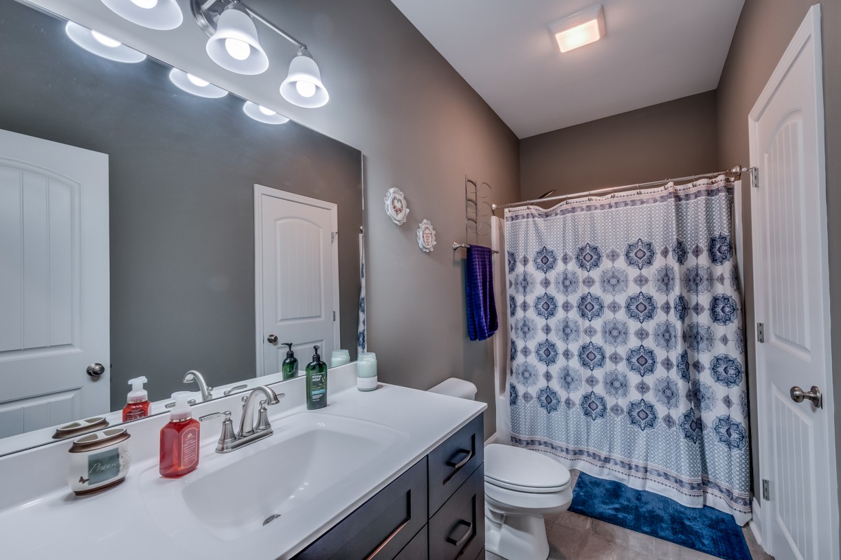 148 A T G T Road Portland, TN 37148 - Photo 21 of 30 a bathroom with a sink a toilet a shower and a mirror