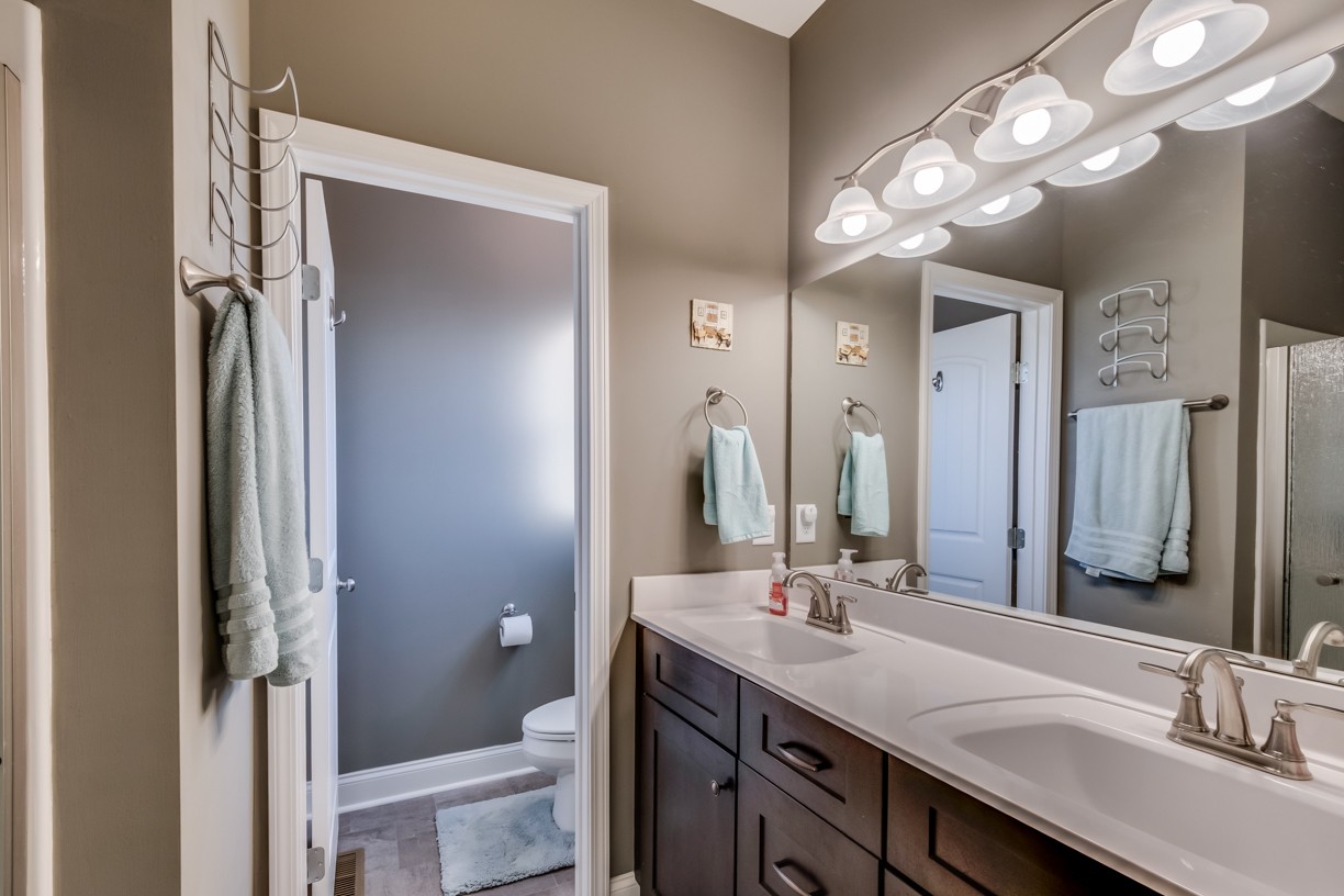 148 A T G T Road Portland, TN 37148 - Photo 27 of 30 a bathroom with a double vanity sink and a mirror