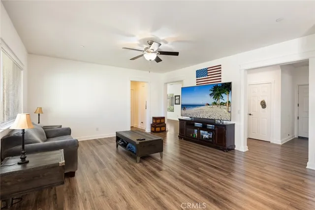 a kitchen with a sink a counter top space stainless steel appliances and cabinets