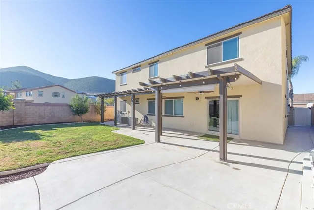 an aerial view of residential houses with outdoor space and river