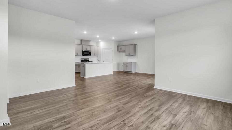 806 Comice Pear Way Willow Spring, NC 27592 - Photo 11 of 37 a view of kitchen with wooden floor and electronic appliances