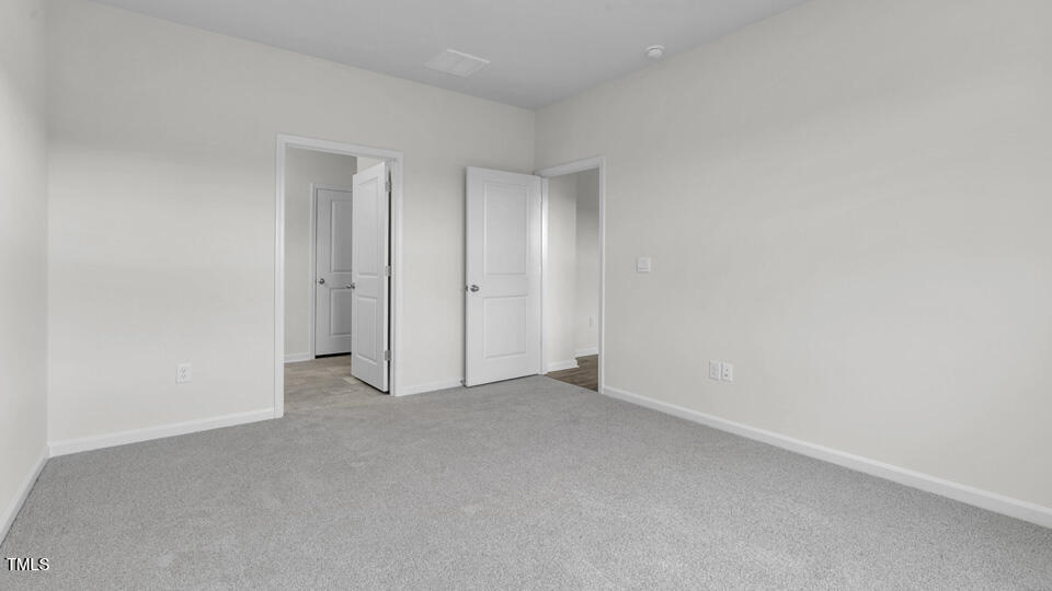 806 Comice Pear Way Willow Spring, NC 27592 - Photo 17 of 37 a view of an empty room and closet