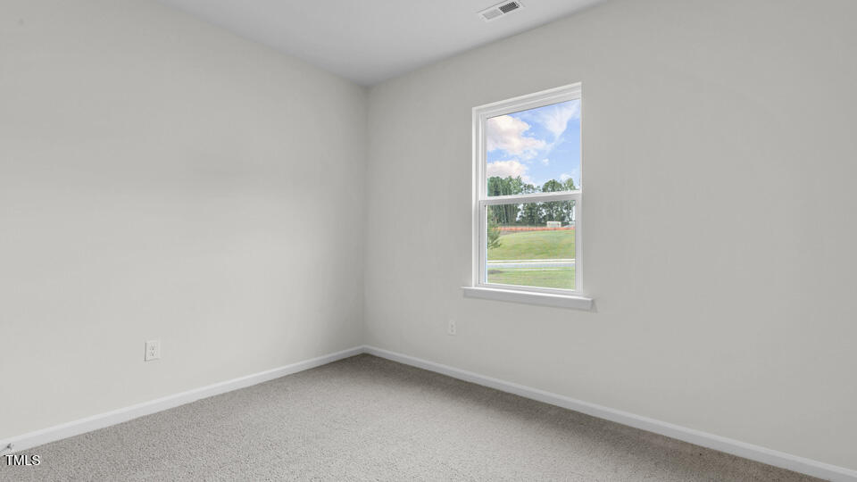806 Comice Pear Way Willow Spring, NC 27592 - Photo 25 of 37 an empty room with a window