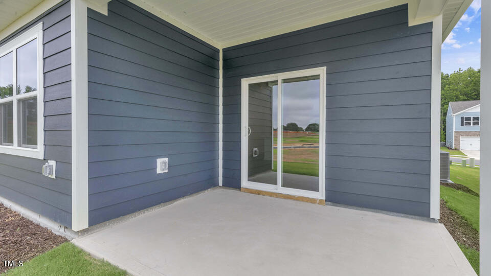 806 Comice Pear Way Willow Spring, NC 27592 - Photo 32 of 37 a view of front door and yard