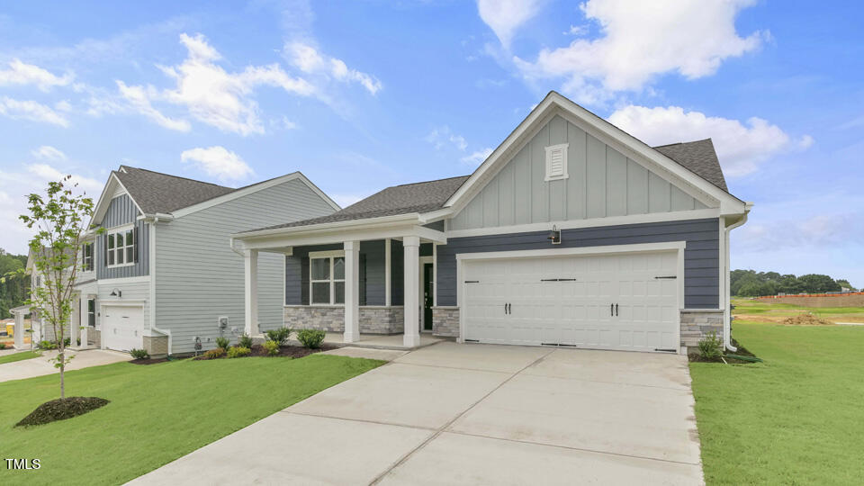 806 Comice Pear Way Willow Spring, NC 27592 - Photo 4 of 37 front view of house with a yard