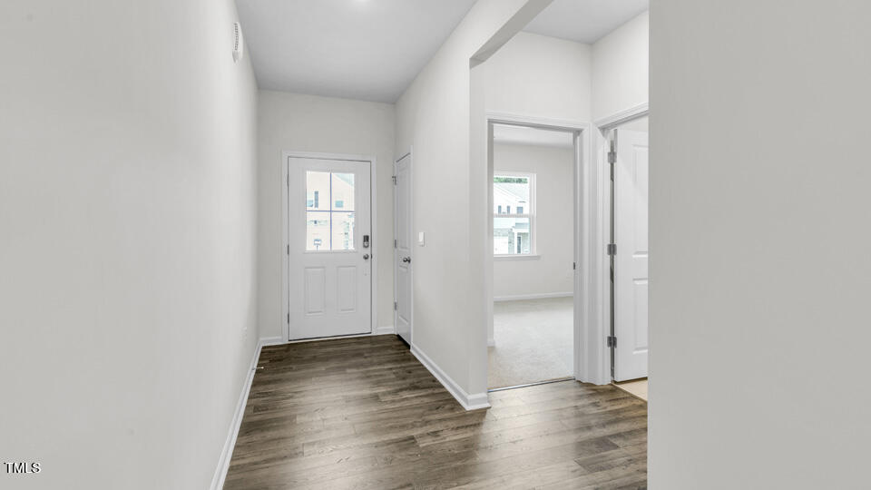806 Comice Pear Way Willow Spring, NC 27592 - Photo 5 of 37 a view of a hallway with wooden floor