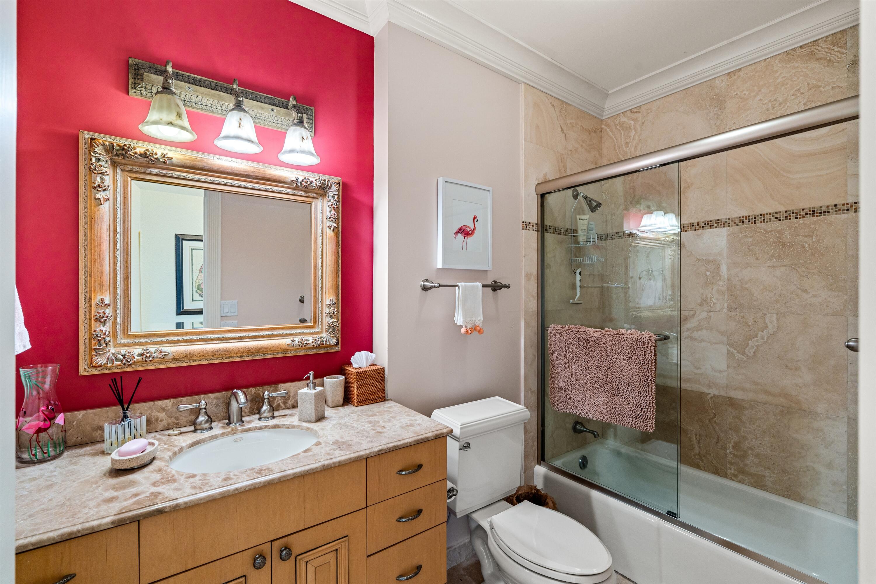 5900 Old Ocean Boulevard, Unit B5 Ocean Ridge, FL 33435 - Photo 15 of 21 a bathroom with a granite countertop toilet sink shower and mirror