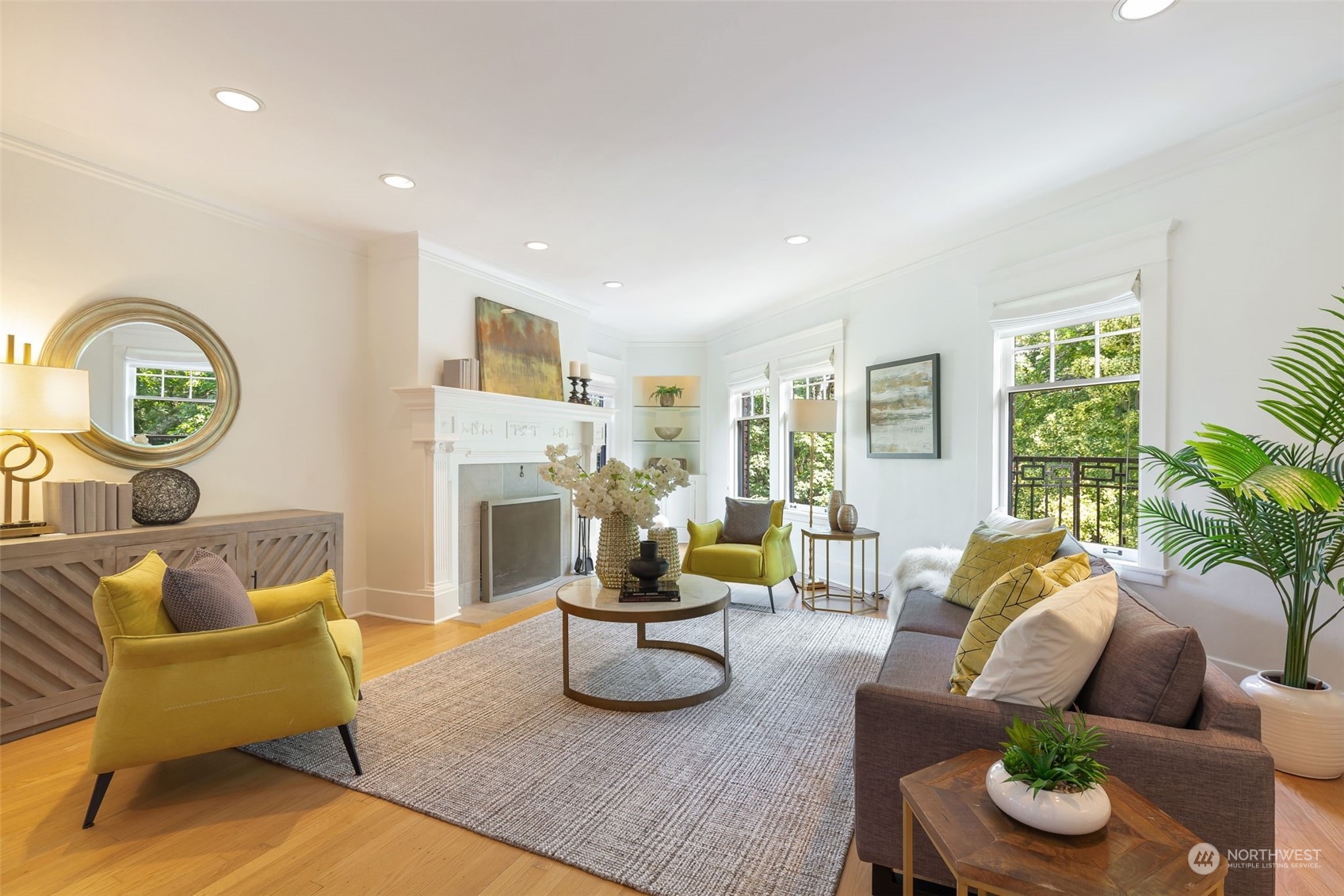 1065 East Prospect Street, Unit 204 Seattle, WA 98102 - Photo 1 of 30 a living room with furniture and a clock