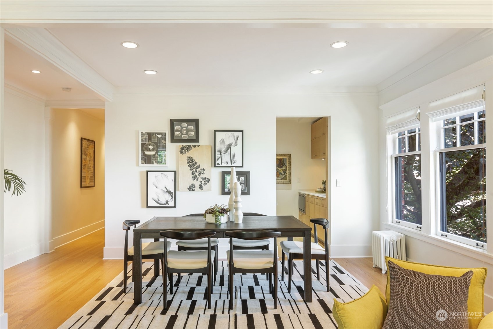 1065 East Prospect Street, Unit 204 Seattle, WA 98102 - Photo 11 of 30 a view of a dining room with furniture and wooden floor
