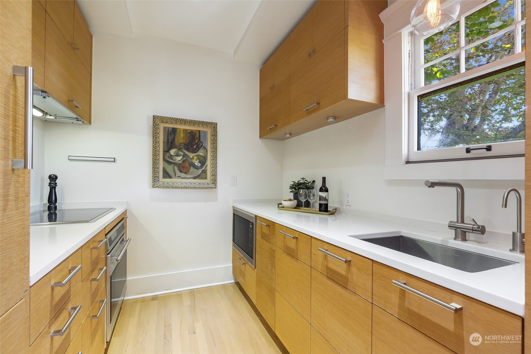 1065 East Prospect Street, Unit 204 Seattle, WA 98102 - Photo 13 of 30 a kitchen with a sink and cabinets