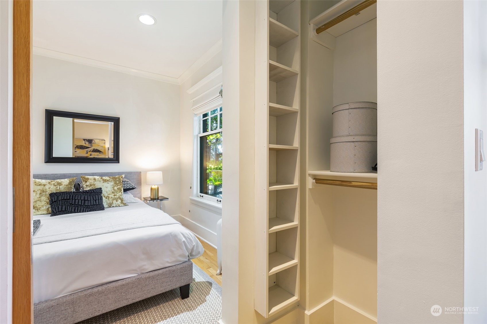 1065 East Prospect Street, Unit 204 Seattle, WA 98102 - Photo 18 of 30 a bedroom with a bed and painting on the wall