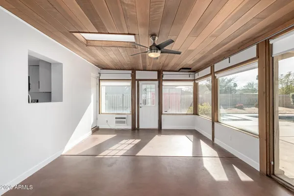 a view of an empty room with a window