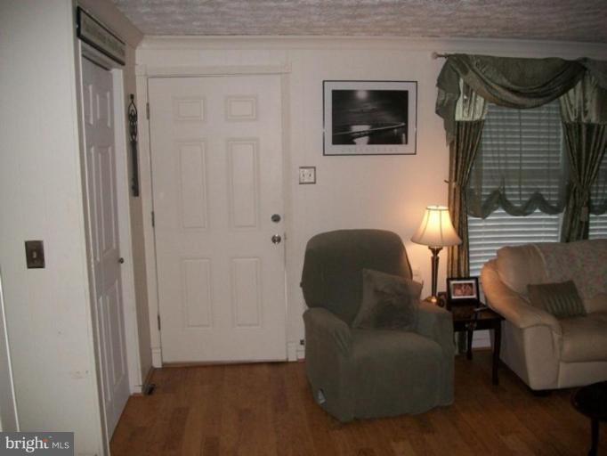 18 Days End Court Rosedale, MD 21237 - Photo 12 of 12 a living room with furniture and a window