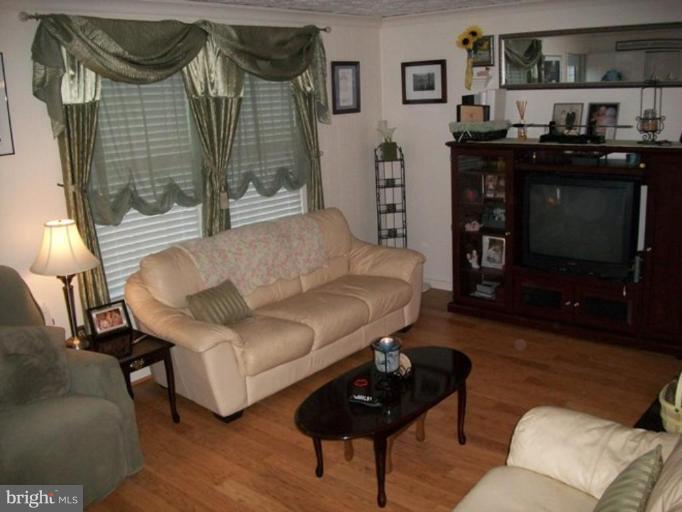 18 Days End Court Rosedale, MD 21237 - Photo 6 of 12 a living room with furniture and a fireplace