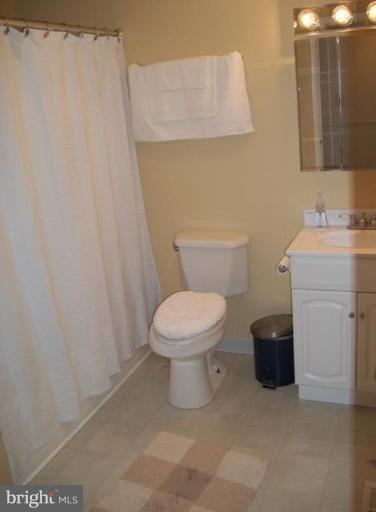 18 Days End Court Rosedale, MD 21237 - Photo 7 of 12 a white toilet sitting next to a bathroom sink