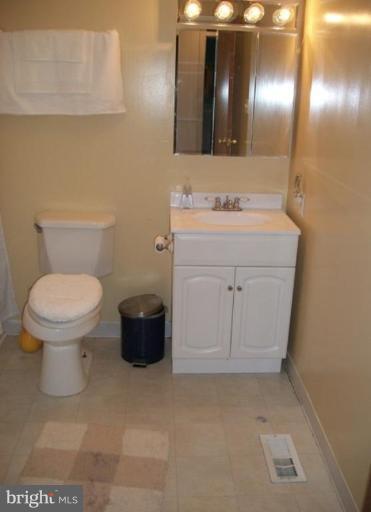 18 Days End Court Rosedale, MD 21237 - Photo 8 of 12 a bathroom with a sink vanity and toilet