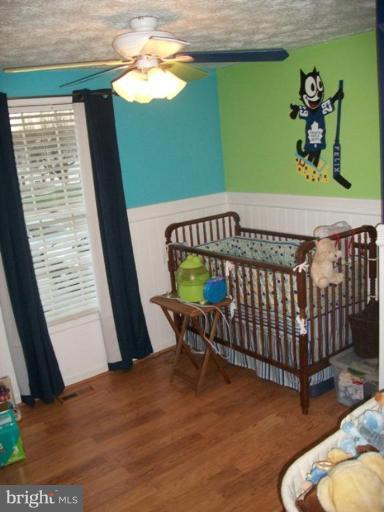 18 Days End Court Rosedale, MD 21237 - Photo 10 of 12 a bedroom with furniture and a window