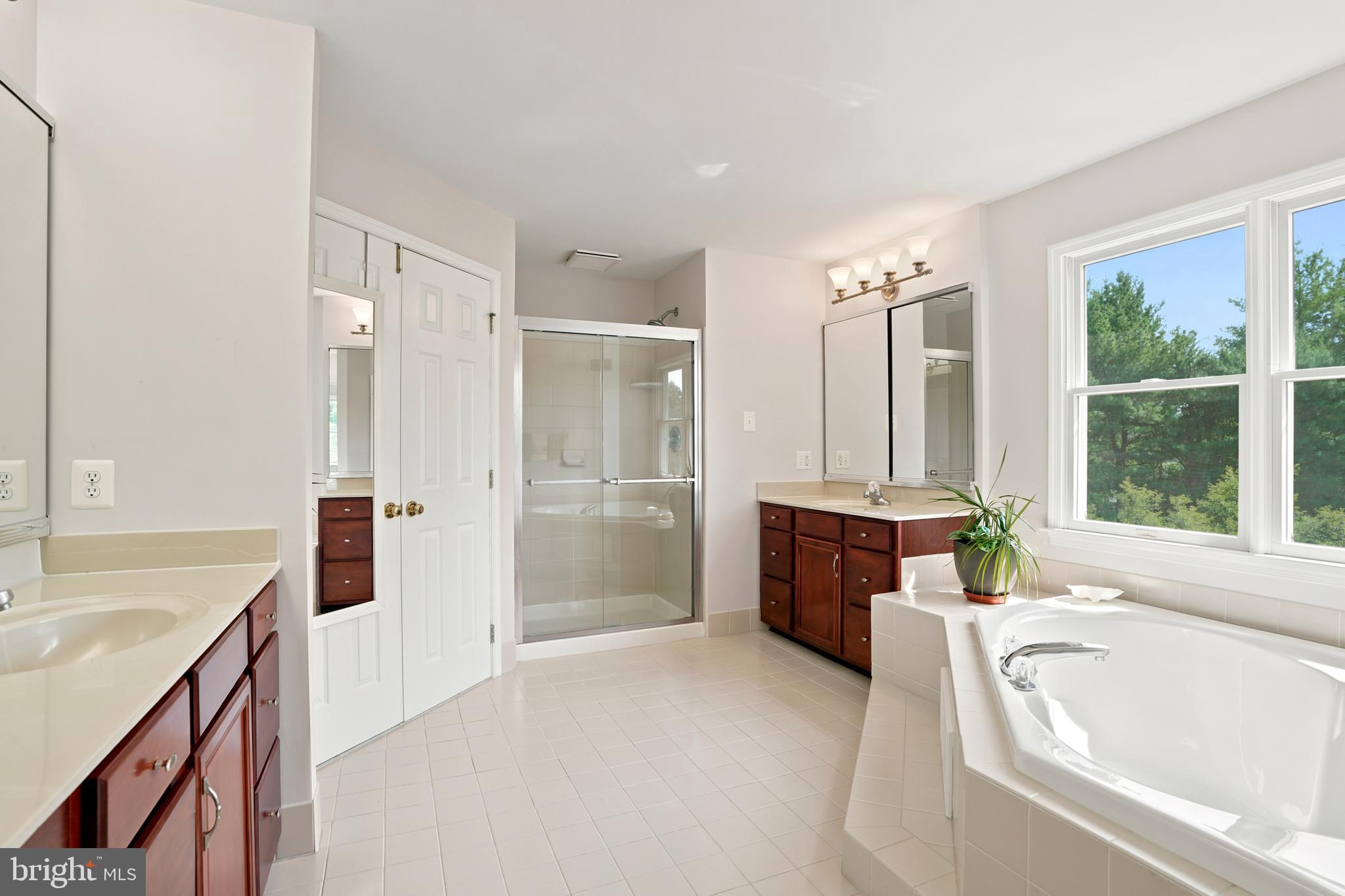 2303 Redtail Road Norristown, PA 19403 - Photo 27 of 53 a spacious bathroom with a tub sink shower and a mirror