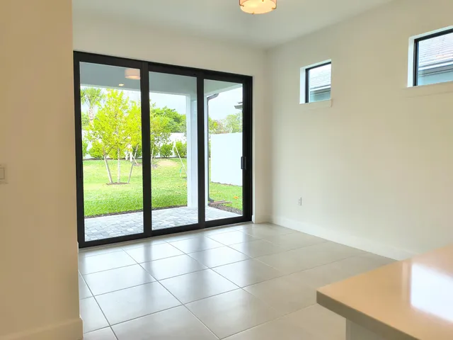 a view of an empty room with windows