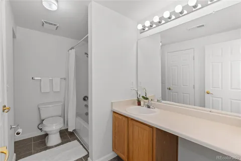 a bathroom with a sink double vanity and a toilet