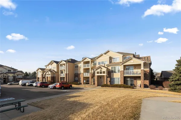 a view of a street with a building in the background