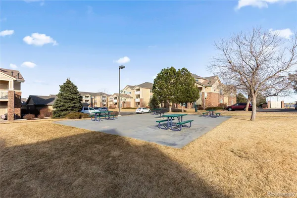 a view of a yard with snow on the road