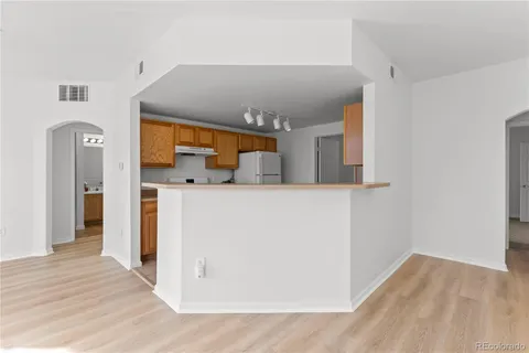 a view of a kitchen from the hallway