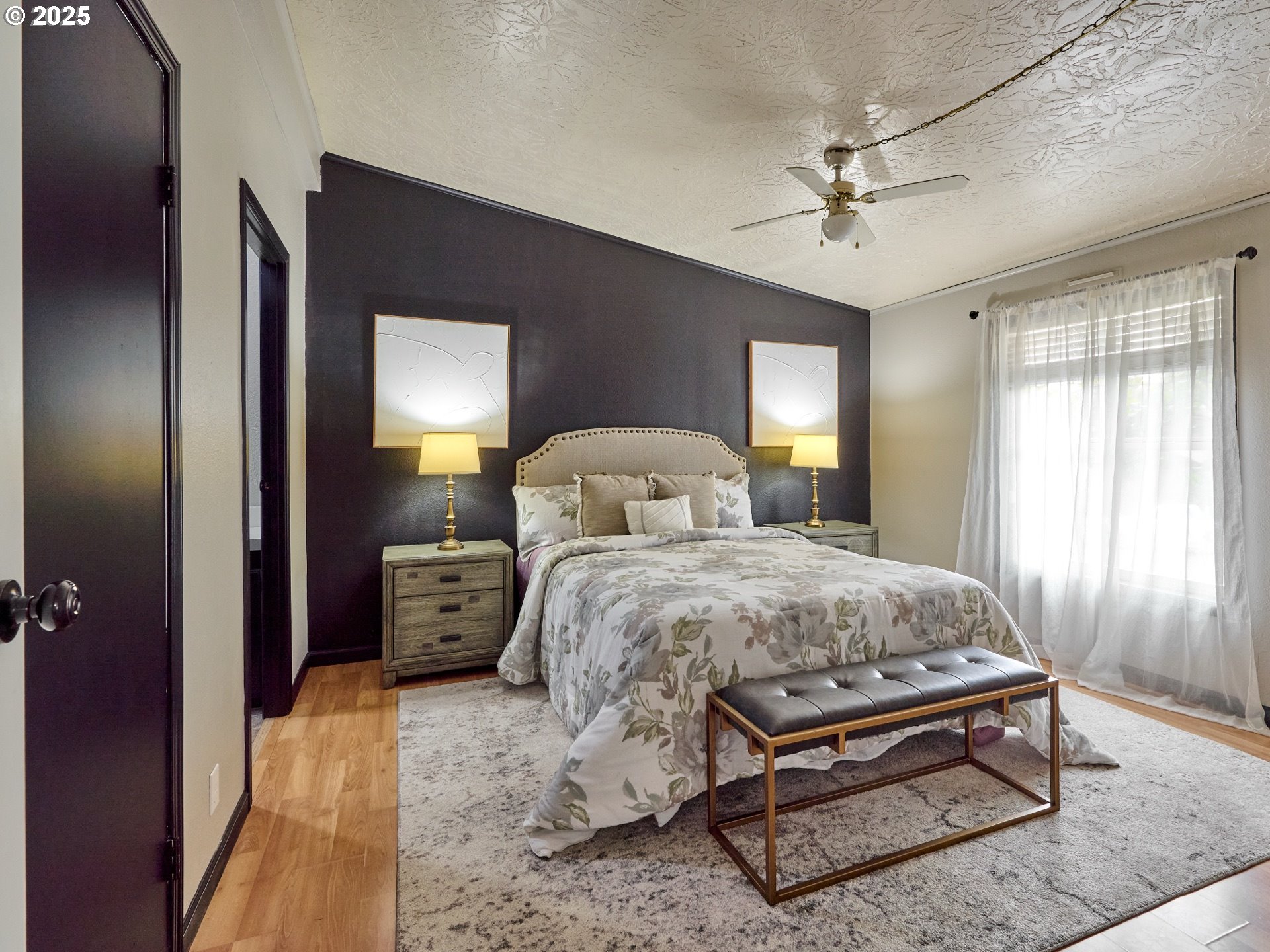 6288 Sherman Road Southeast Aumsville, OR 97325 - Photo 11 of 45 a bedroom with a bed and a chandelier