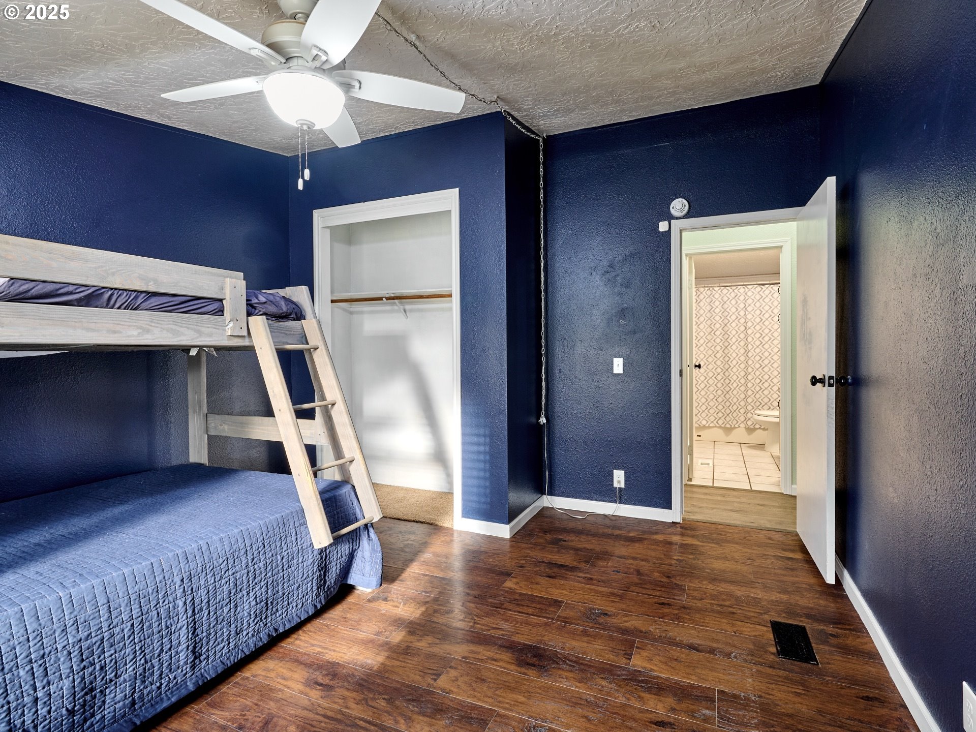6288 Sherman Road Southeast Aumsville, OR 97325 - Photo 15 of 45 a bedroom with a bed and a chandelier