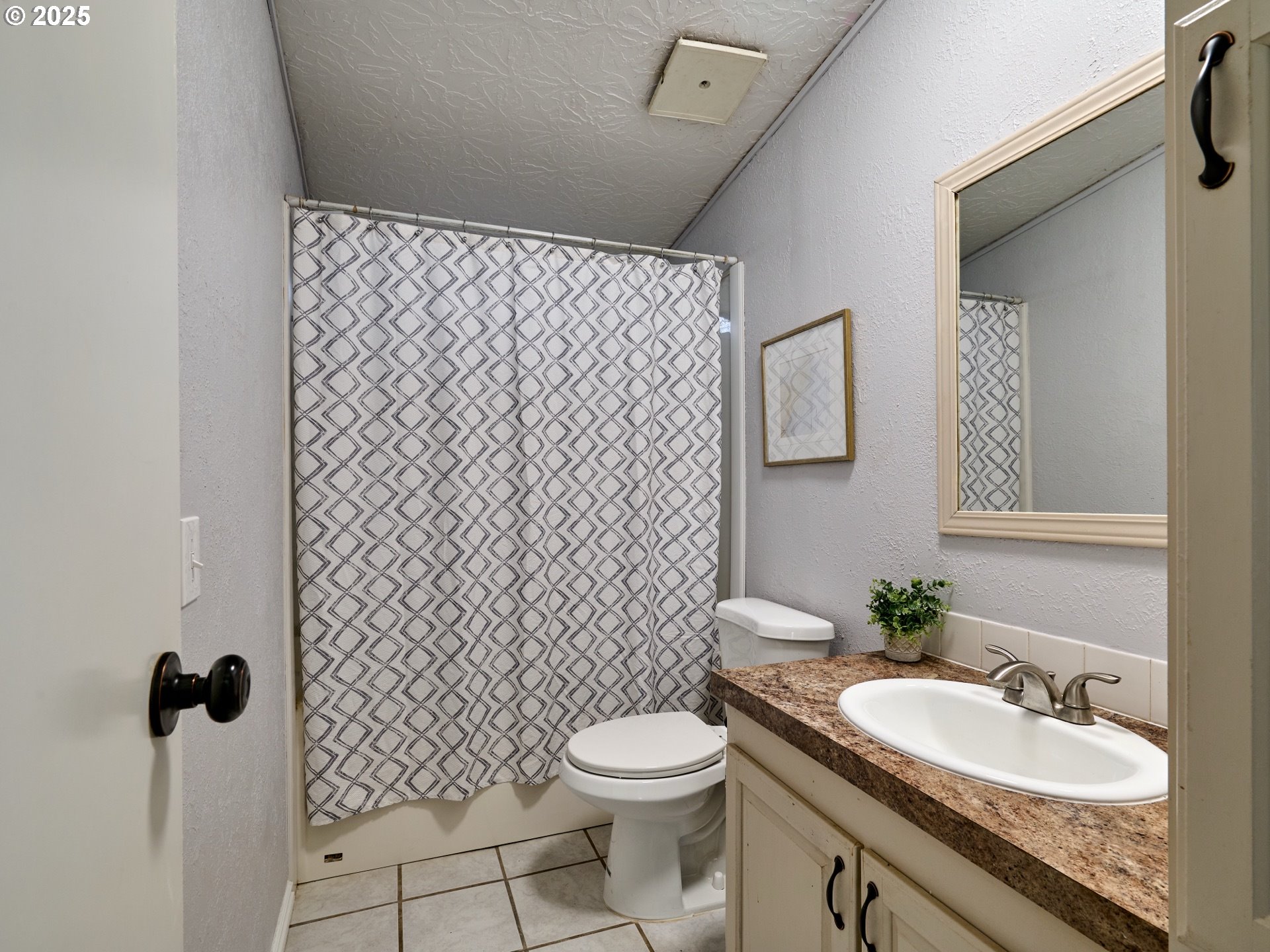 6288 Sherman Road Southeast Aumsville, OR 97325 - Photo 18 of 45 a bathroom with a granite countertop toilet a sink and a mirror