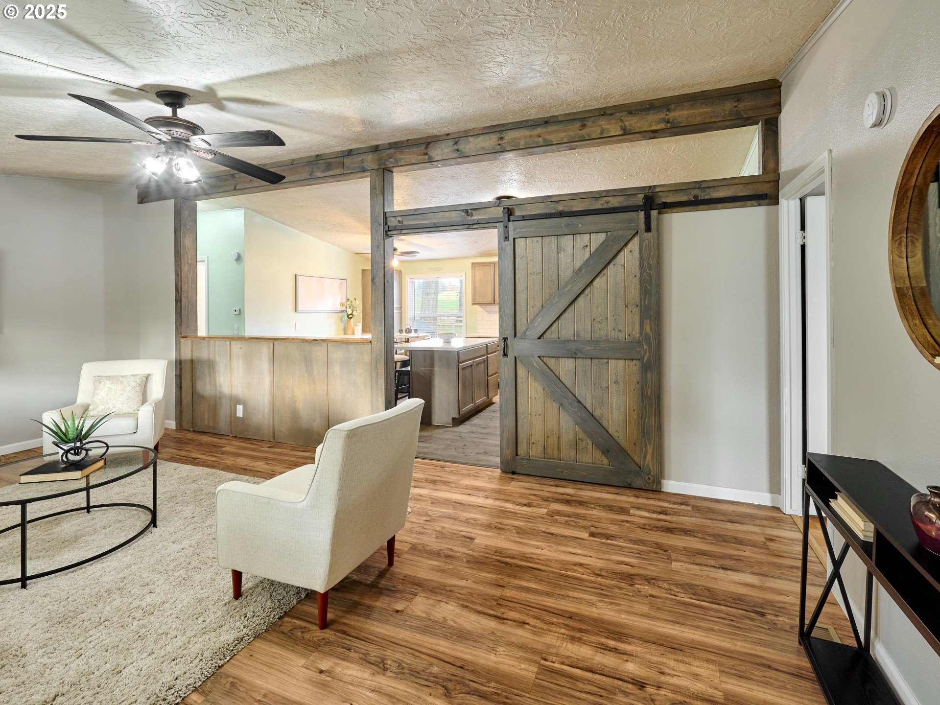 6288 Sherman Road Southeast Aumsville, OR 97325 - Photo 5 of 45 a workspace room with wooden floor table and windows