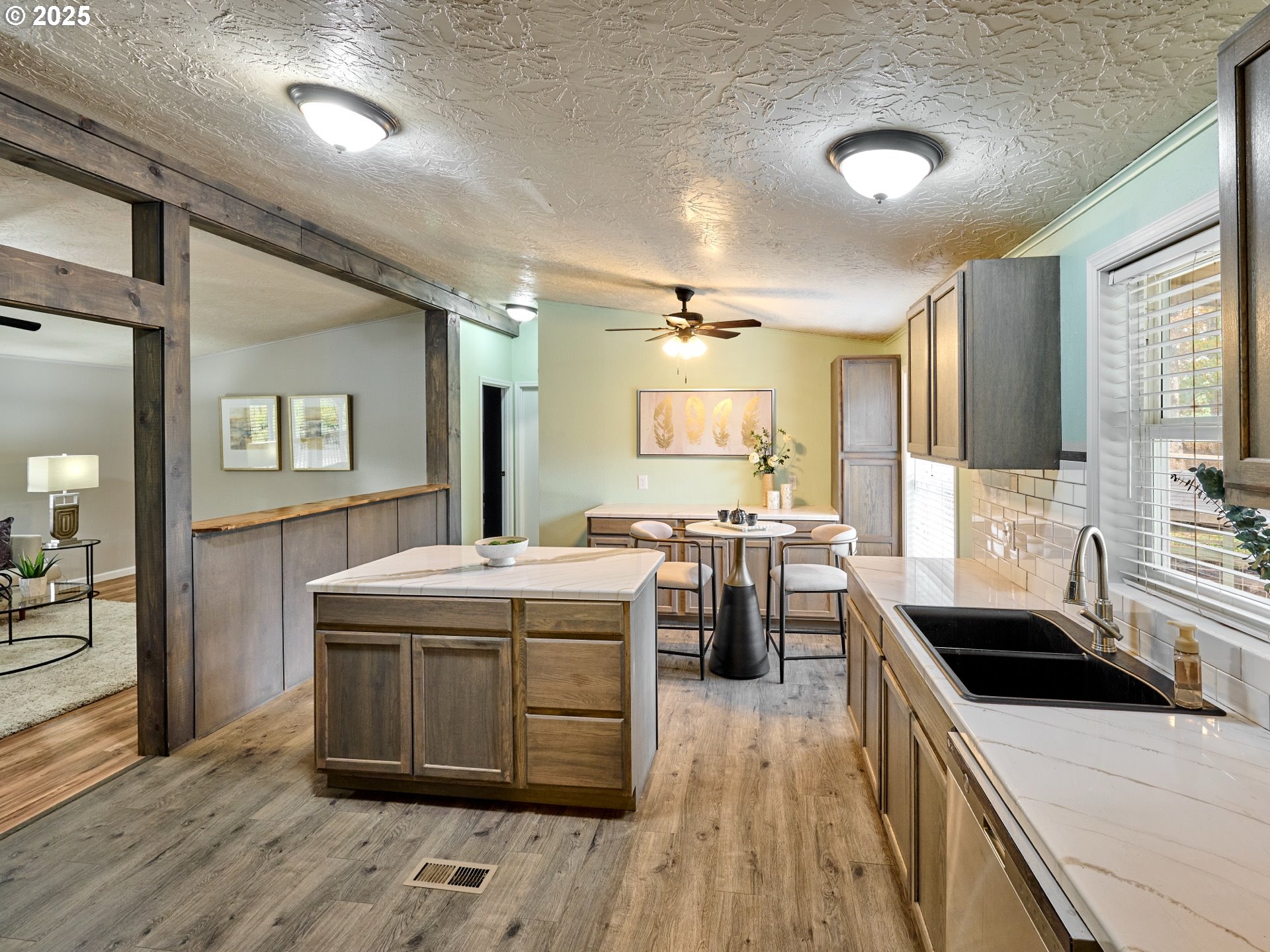 6288 Sherman Road Southeast Aumsville, OR 97325 - Photo 6 of 45 a kitchen that has a sink and a stove in it
