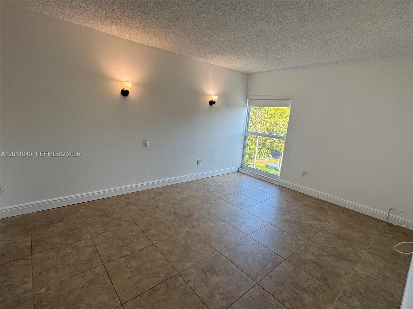 2160 Southwest 16th Avenue, Unit 416 Miami, FL 33145 - Photo 20 of 32 an empty room with windows