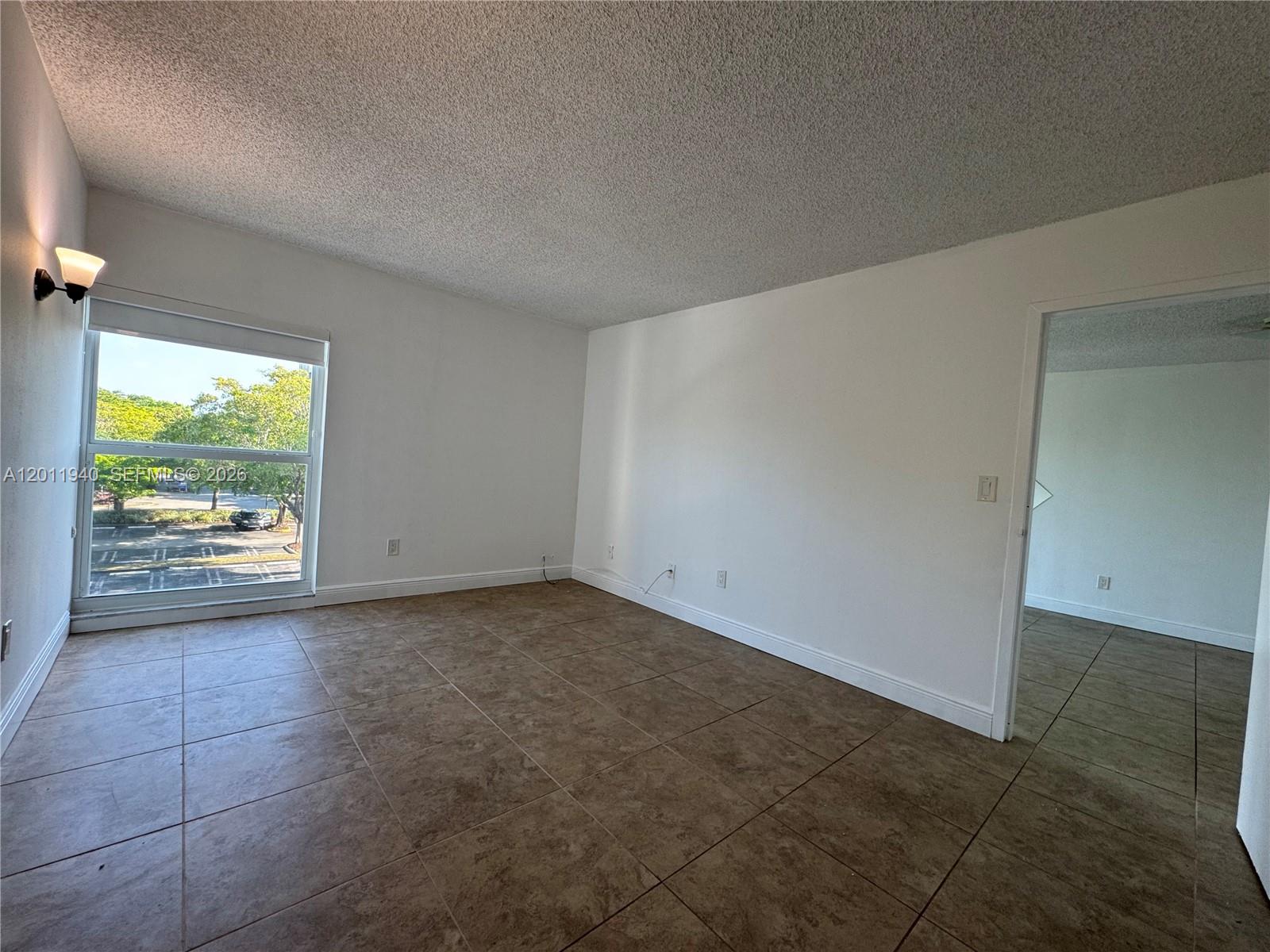 2160 Southwest 16th Avenue, Unit 416 Miami, FL 33145 - Photo 22 of 32 an empty room with a window