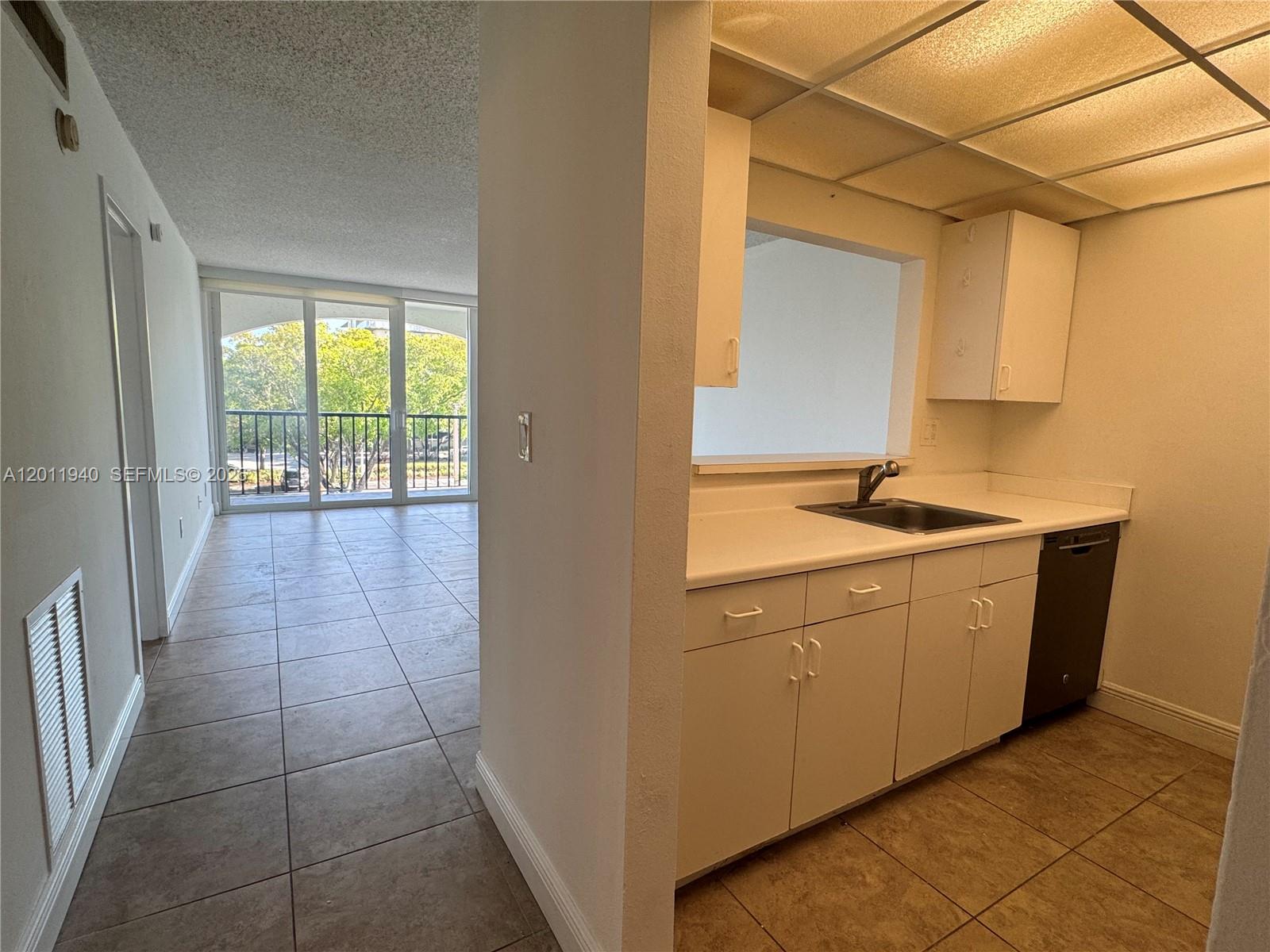 2160 Southwest 16th Avenue, Unit 416 Miami, FL 33145 - Photo 23 of 32 a bathroom with a sink a toilet and a shower