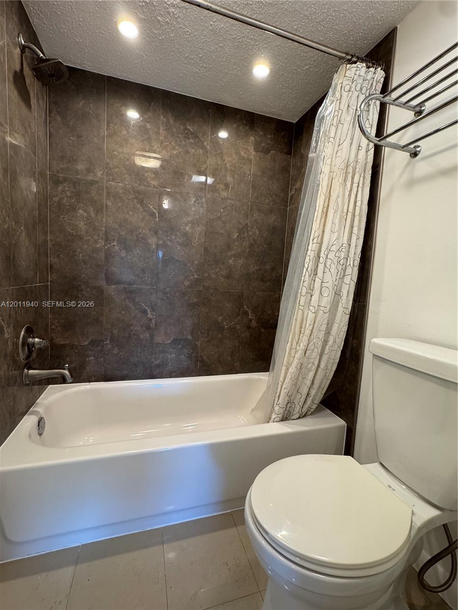 2160 Southwest 16th Avenue, Unit 416 Miami, FL 33145 - Photo 28 of 32 a bathroom with a sink and a mirror