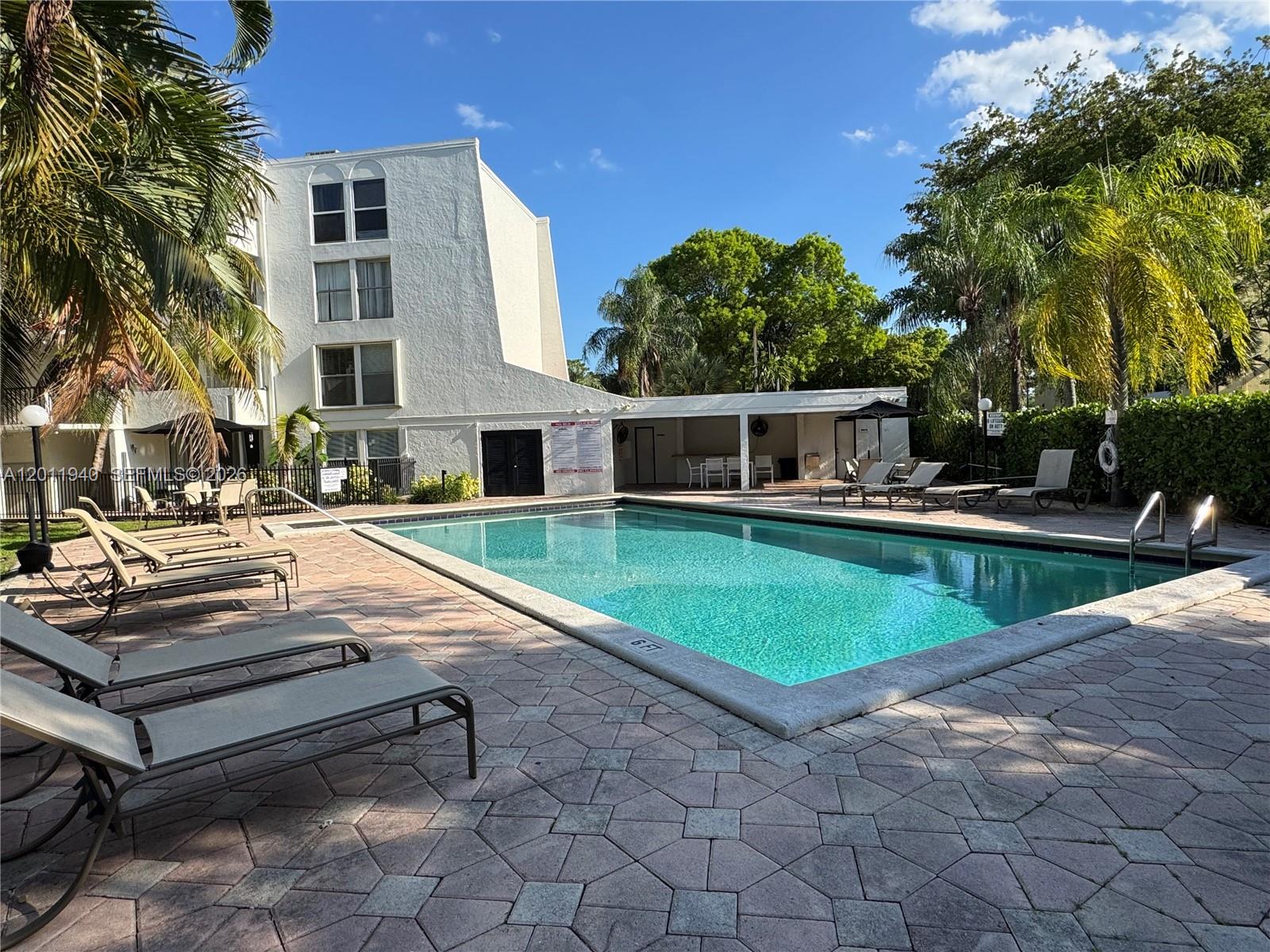 2160 Southwest 16th Avenue, Unit 416 Miami, FL 33145 - Photo 3 of 32 a view of house with swimming pool and sitting area