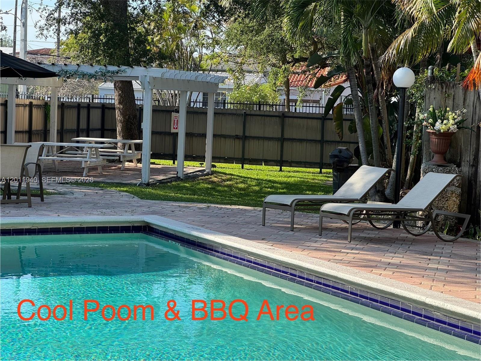 2160 Southwest 16th Avenue, Unit 416 Miami, FL 33145 - Photo 6 of 32 a view of backyard with a patio and outdoor seating