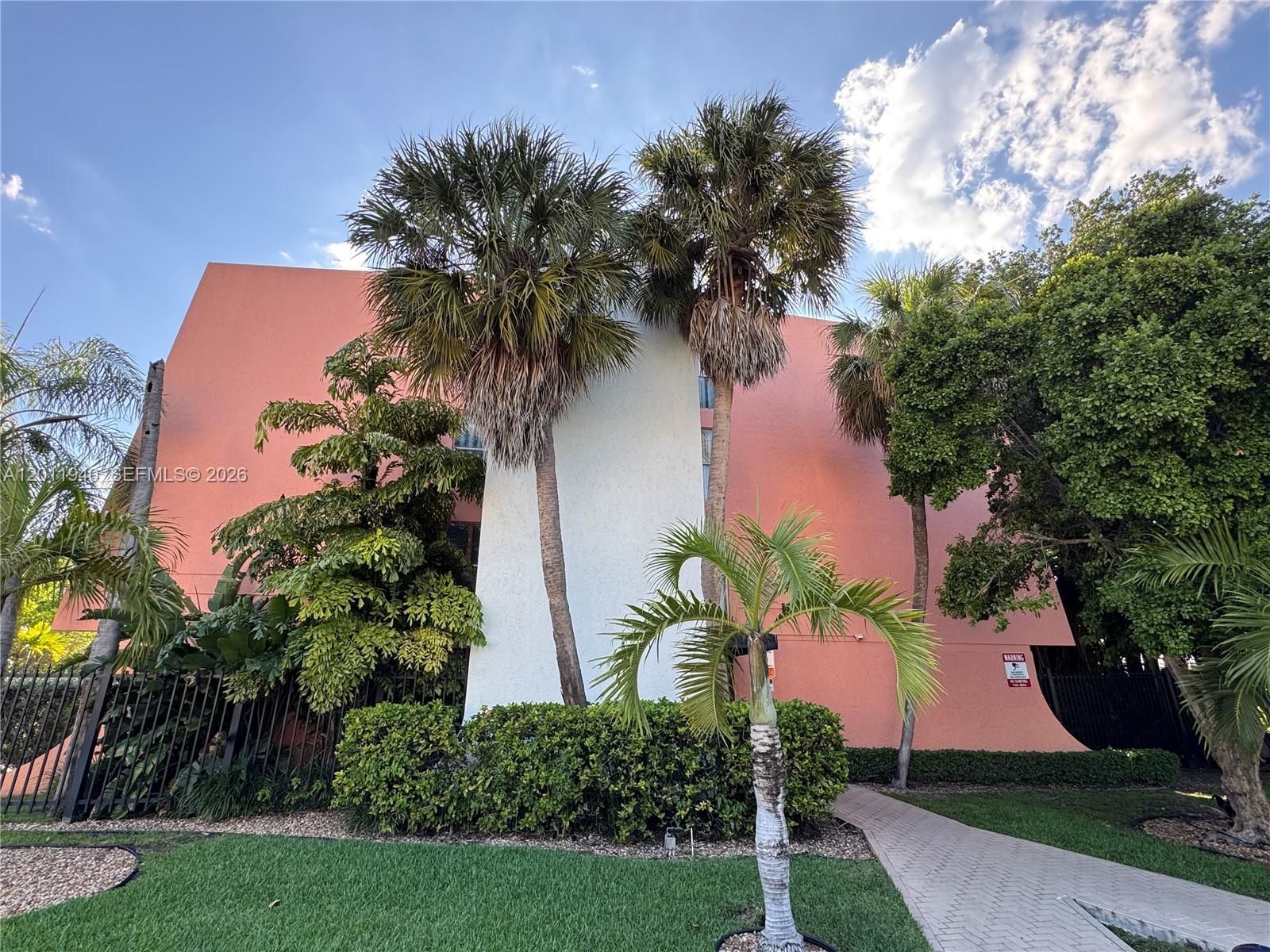 2160 Southwest 16th Avenue, Unit 416 Miami, FL 33145 - Photo 9 of 32 a view of a yard with palm trees