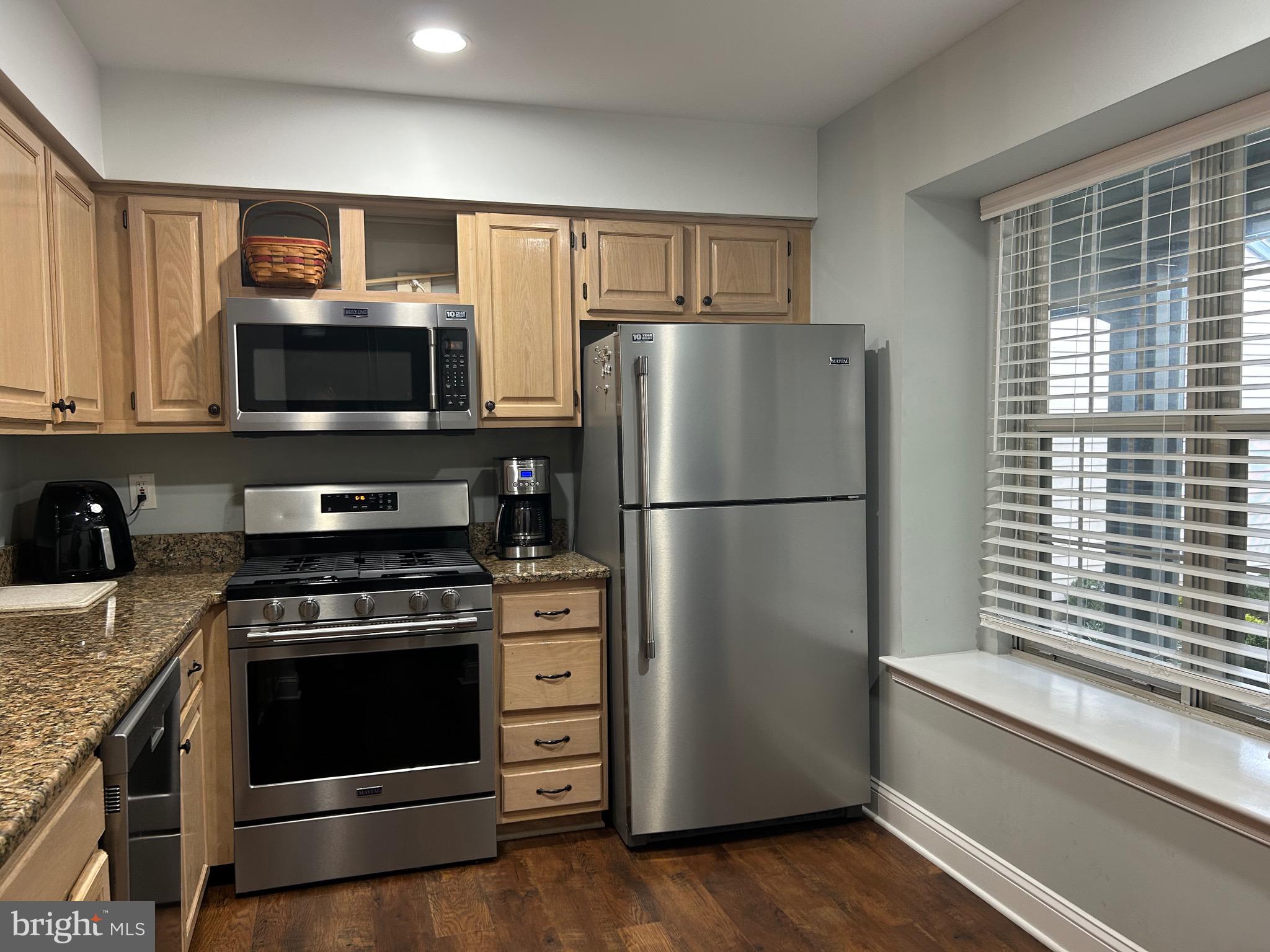74 Kettlebrook Drive Mount Laurel, NJ 08054 - Photo 16 of 29 a kitchen with granite countertop a refrigerator stove and microwave