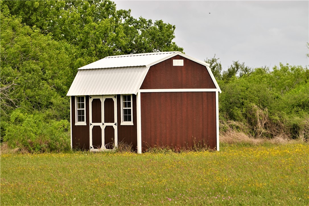 0 County Road 1910 Gregory, TX 78359 - Photo 19 of 21 a front view of a house with a yard