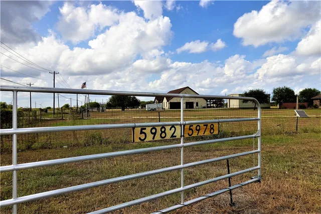 a view of a brick building with many windows