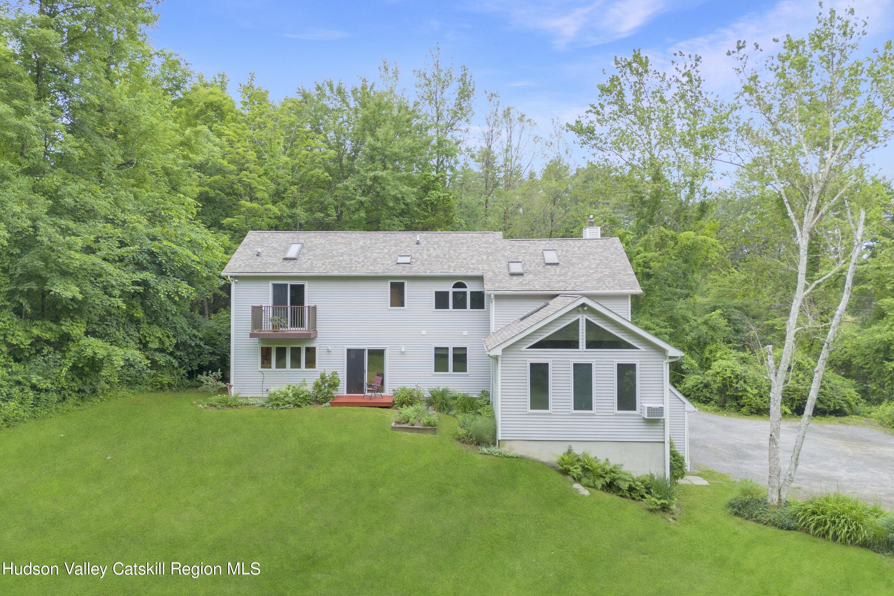 70 Duck Pond Road Stone Ridge, NY 12484 - Photo 7 of 25 front view of a house with a yard