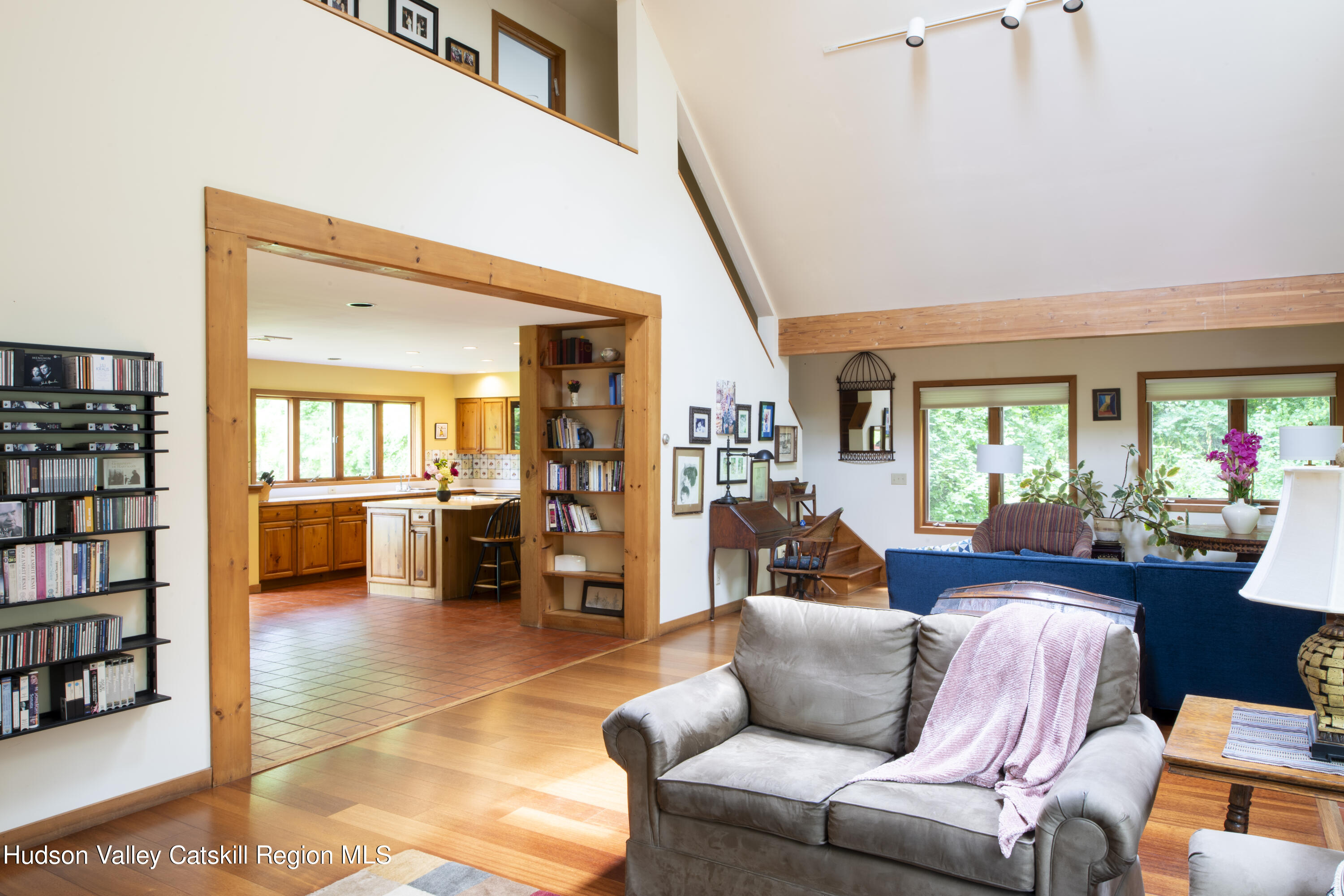 70 Duck Pond Road Stone Ridge, NY 12484 - Photo 10 of 25 a living room with furniture and a book shelf