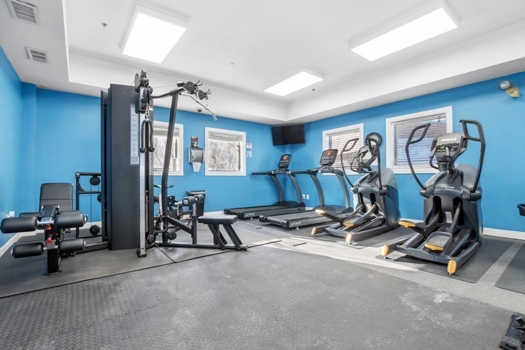 165 Cottage Street, Unit 410 Chelsea, MA 02150 - Photo 17 of 25 a view of a room with gym equipment