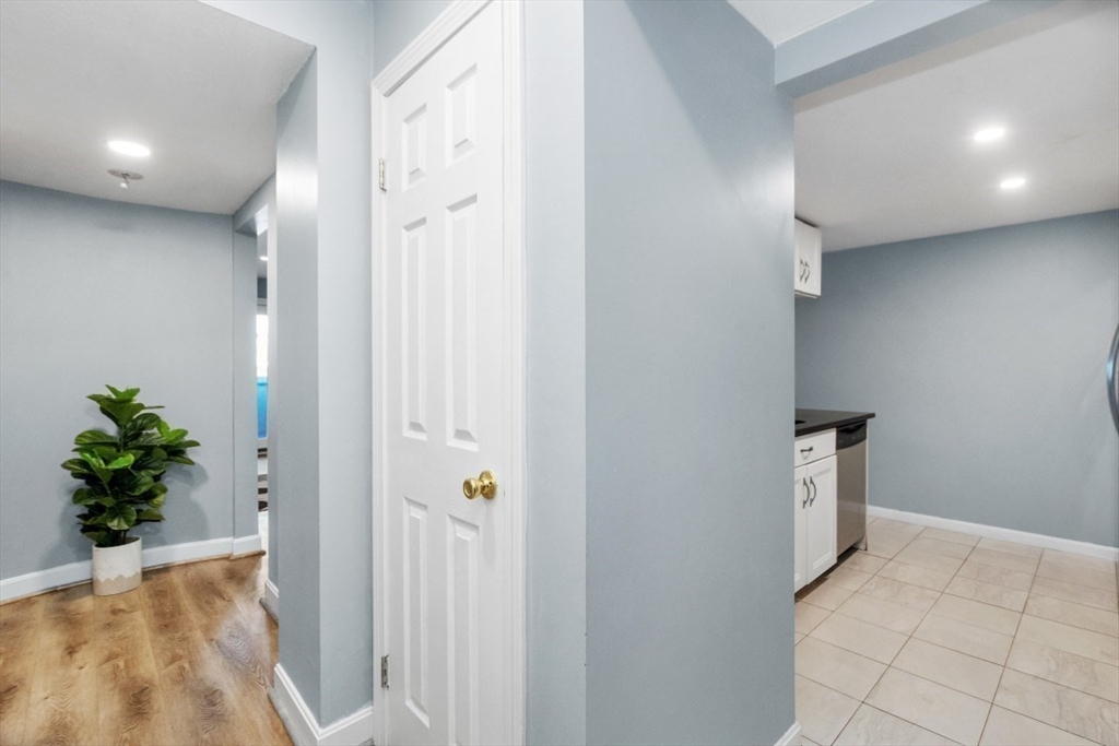 165 Cottage Street, Unit 410 Chelsea, MA 02150 - Photo 4 of 25 a view of an entryway with wooden floor