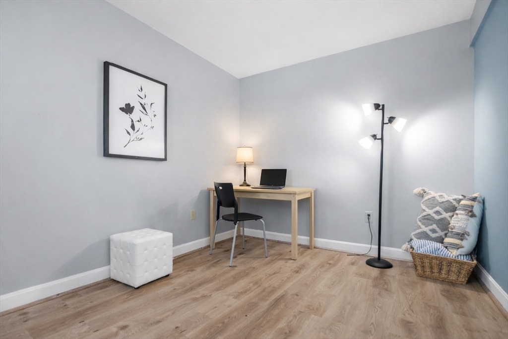 165 Cottage Street, Unit 410 Chelsea, MA 02150 - Photo 10 of 25 a workspace with furniture and window