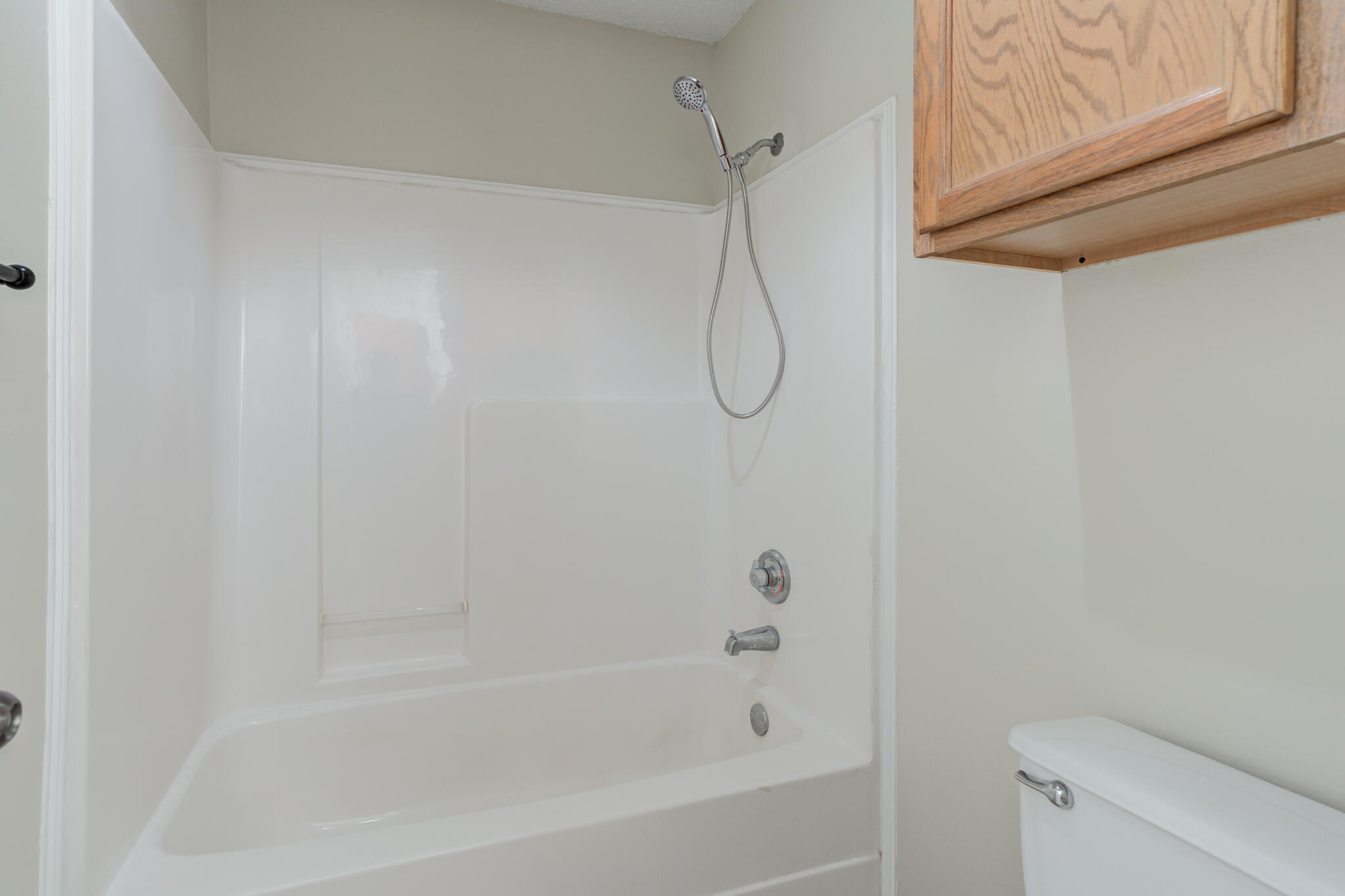 6713 85th Street Lubbock, TX 79424 - Photo 14 of 16 a close up of a bathtub curtain
