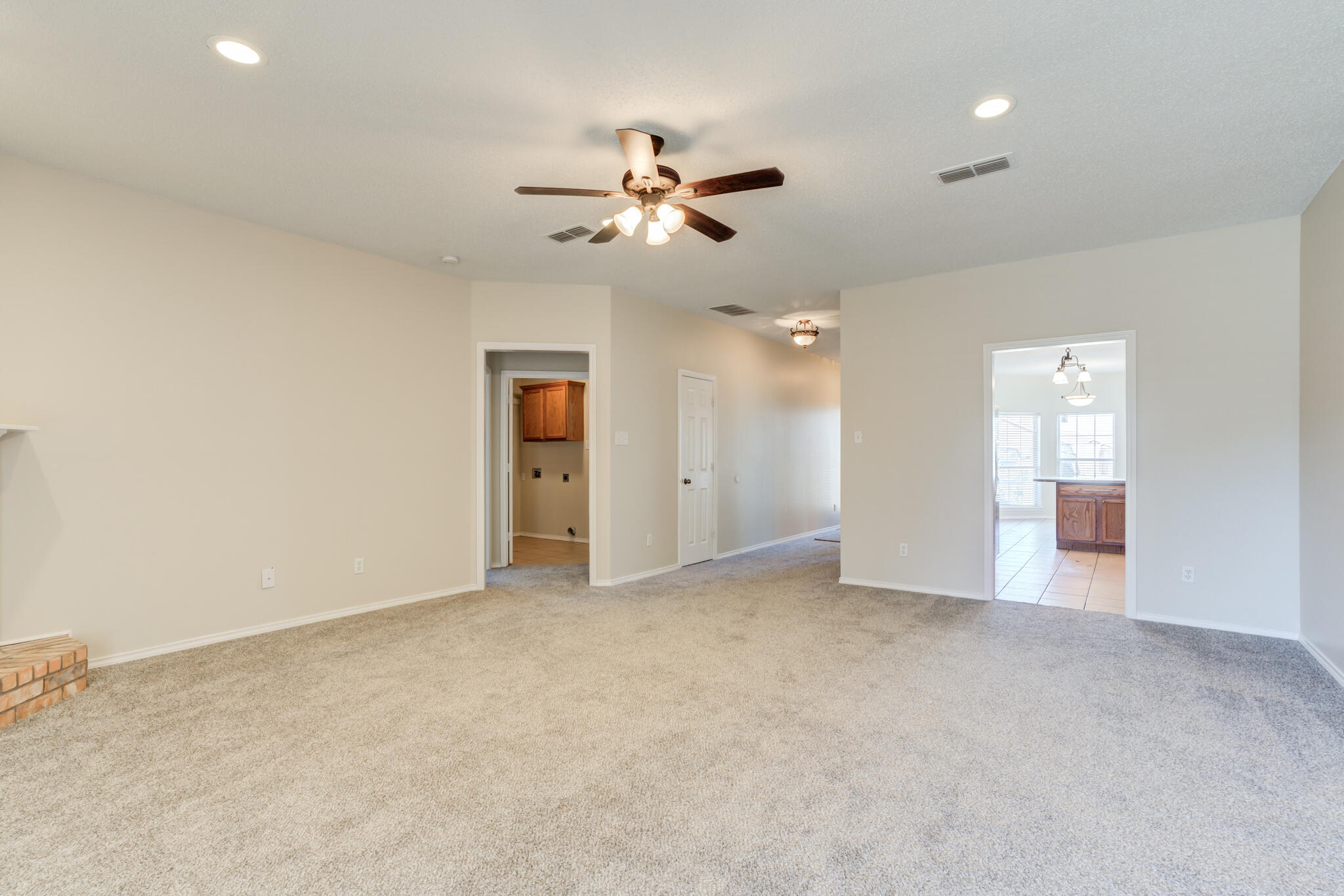 6713 85th Street Lubbock, TX 79424 - Photo 7 of 16 an empty room with closet and windows